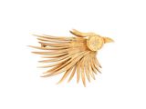 a bird that is flying in the air with its wings spread