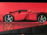 a red box with a picture of a red sports car on it