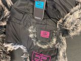 a black jacket with a pink and blue logo on it