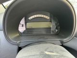 a car dashboard with a speedometer in the middle of it