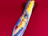 an image of a fish on a red surface with a red background