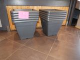 two bins that are sitting on the floor