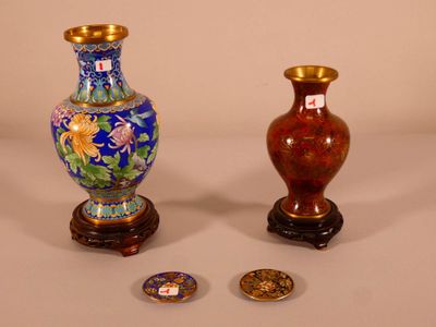 two vases sitting next to each other on a table