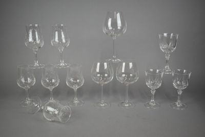 many empty wine glasses sitting on a table
