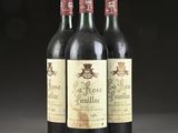 three bottles of wine sitting on top of a table next to each other