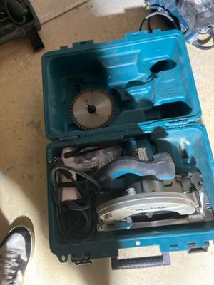 a blue tool box with tools in it on the floor