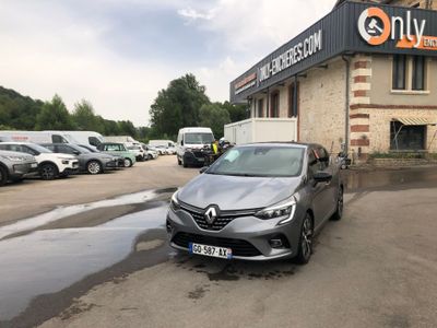 a car parked in front of a building with cars parked in front of it