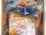 two paintings of fruit on a table in a room
