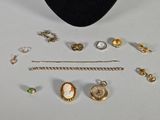 a lot of jewelry that is laying out on the table
