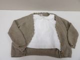 a white shirt and a brown cardigan on a table