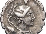 a close up of a silver coin with a woman ' s head on it
