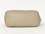a tan leather toilet bag on a white background