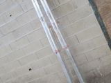 a pair of skis leaning against a brick wall
