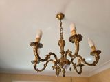 a chandelier that is hanging from the ceiling in the room