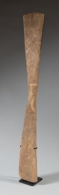 wooden sculpture of a curved body on a black base