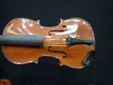 a violin that is sitting on top of a table