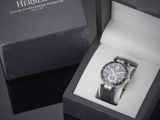 a watch that is in a box on a table
