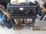several pieces of luggage sitting on top of a cart in a garage
