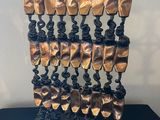an image of a sculpture made out of gold and black metal