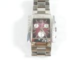 a watch that is sitting on a white surface