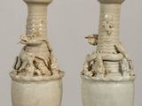 two vases that are sitting on a table