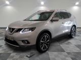 the silver nissan suv is parked on a checkered tile floor