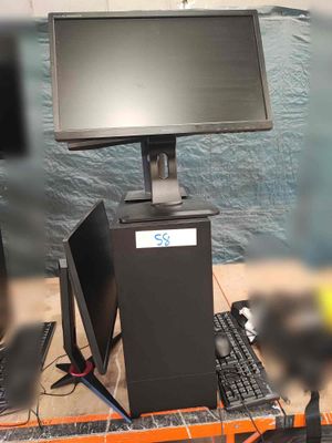 a picture of a computer desk with a monitor and keyboard