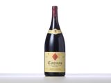 a bottle of red wine sitting on top of a table