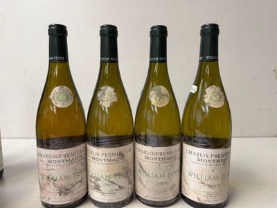 four bottles of wine are lined up on a table