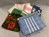 several pieces of cloth sitting on top of a couch next to each other