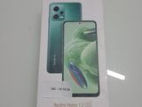 une photo d'une boîte de Redmi Note 11 Lite posée sur une table