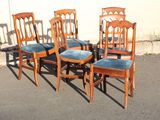 four chairs that are sitting in the parking lot