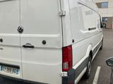 a white van that is parked in a parking lot
