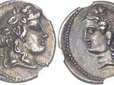a close up of a coin with a woman ' s face on it