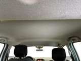 two seats in the back of a car with a view out the window
