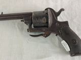 an old gun that is sitting on a table