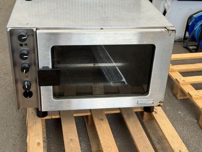 an image of a toaster oven sitting on a pallet