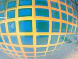 a large blue and yellow sphere with squares on it