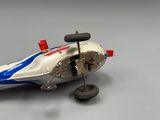 a model of a racing car on a white surface