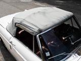 a white car parked on the side of the road