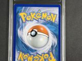 a close up of a pokemon card in a plastic case