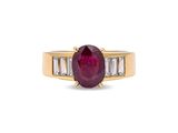 an oval ruby and baguet diamond ring