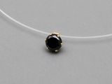 a necklace with a black stone in the middle of it