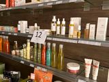 many different types of skin care products displayed on the shelves