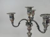 a silver candelab with two candles on it