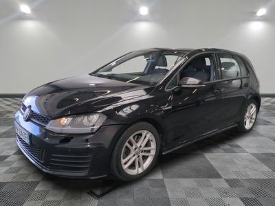 a picture of a black car parked in a garage