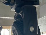 a black object hanging from the ceiling in a room