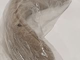 a banana wrapped in plastic sitting on a table