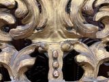 a close up view of a decorative gold door