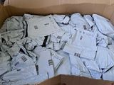 a cardboard box full of white shirts in it